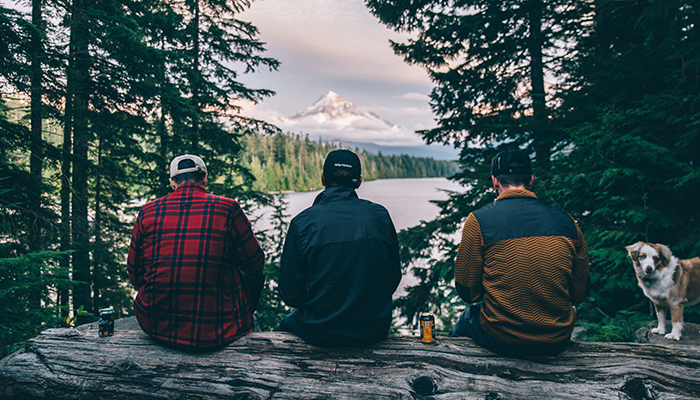 Three men take in the scenic view of Mt. Hood.