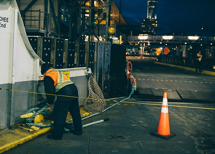 Crew member hard at work, as night falls.